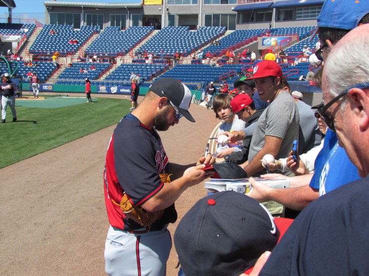 Evan Gattis signing autographs